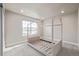 Spacious bedroom with a neutral color palette and carpeted floor at 12224 Olive Way, Thornton, CO 80602