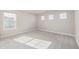 Well-lit bedroom featuring carpet flooring and multiple windows at 12224 Olive Way, Thornton, CO 80602