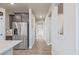 Light and bright hallway with neutral walls and wood-look flooring at 12224 Olive Way, Thornton, CO 80602