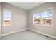 A clean, well-lit bedroom with neutral walls and carpet, offering a blank canvas for personal touches at 9587 Kentwick Cir, Englewood, CO 80112