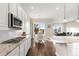 Open concept kitchen and dining area with granite countertops and stainless steel appliances at 9587 Kentwick Cir, Englewood, CO 80112