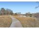 Peaceful pond with walkway, surrounded by trees, offering a serene setting at 5470 S Jasper Way, Centennial, CO 80015