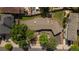 An aerial view showcases the home's backyard, patio area, lush green landscaping, and driveway at 2175 S Joliet St, Aurora, CO 80014
