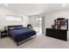 Bedroom with sliding glass doors and neutral colors, carpeted floors at 2175 S Joliet St, Aurora, CO 80014