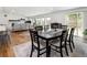 Inviting dining area showcasing a modern table and chairs, flowing into the adjacent living space at 2175 S Joliet St, Aurora, CO 80014