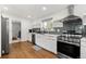 Well-lit kitchen featuring stainless steel appliances, modern cabinetry, and sleek countertops at 2175 S Joliet St, Aurora, CO 80014