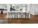 Open kitchen features a large island with counter seating and stainless steel appliances at 2175 S Joliet St, Aurora, CO 80014