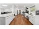 Spacious kitchen with modern white cabinets, stainless steel appliances, and an open layout at 2175 S Joliet St, Aurora, CO 80014