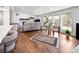 Inviting living room filled with natural light, a fireplace, hardwood floors, and modern furniture at 2175 S Joliet St, Aurora, CO 80014