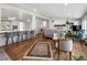 Open concept living space with kitchen island, hardwood floors, and natural light at 2175 S Joliet St, Aurora, CO 80014