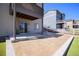View of the backyard with a patio, an overhang, and manicured landscaping with lawn at 2243 Villageview Ln, Castle Rock, CO 80104
