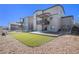 Beautifully landscaped backyard with artificial turf, a patio and well-maintained surroundings at 2243 Villageview Ln, Castle Rock, CO 80104