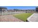 Large backyard that has low-maintenance landscaping and a white fence surrounding the perimeter at 2243 Villageview Ln, Castle Rock, CO 80104
