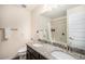 Bathroom featuring dual sinks, a granite countertop, and a shower-tub combo at 2243 Villageview Ln, Castle Rock, CO 80104