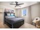 Cozy bedroom featuring a ceiling fan, modern decor, and a window with sheer curtains at 2243 Villageview Ln, Castle Rock, CO 80104