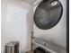 Modern laundry room featuring stainless steel washer and dryer with a dark gray finish at 2243 Villageview Ln, Castle Rock, CO 80104