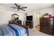 Spacious bedroom boasts a bed, dressers, ceiling fan, and access to ensuite bathroom and closet at 2243 Villageview Ln, Castle Rock, CO 80104