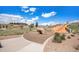 Community playground with a slide and rock structure under a bright blue sky with puffy clouds at 2243 Villageview Ln, Castle Rock, CO 80104