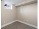 Finished basement featuring carpet, a small window, and neutral paint at 1901 S Lincoln St, Denver, CO 80210