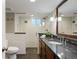 The modern bathroom showcases a walk-in shower, a sleek vanity, and contemporary finishes for a luxurious retreat at 1901 S Lincoln St, Denver, CO 80210