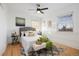 Bright bedroom featuring a queen bed, hardwood floors, modern decor, and natural light at 1901 S Lincoln St, Denver, CO 80210