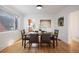 Bright dining room featuring hardwood floors and a view into the kitchen at 1901 S Lincoln St, Denver, CO 80210