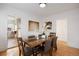 Bright dining room features hardwood floors, a modern table with six chairs, and neutral decor at 1901 S Lincoln St, Denver, CO 80210