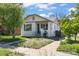 Charming white bungalow with a quaint front yard and inviting curb appeal, perfect for a starter home at 1901 S Lincoln St, Denver, CO 80210