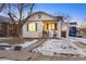 Charming bungalow with a freshly painted exterior and snowy lawn at 1901 S Lincoln St, Denver, CO 80210