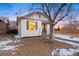 Charming bungalow with a freshly painted exterior and snowy lawn at 1901 S Lincoln St, Denver, CO 80210