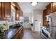 Cozy kitchen with granite countertops, wood cabinets and stainless steel appliances at 1901 S Lincoln St, Denver, CO 80210