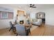 Bright living room with a gray sofa, fireplace, and hardwood floors at 1901 S Lincoln St, Denver, CO 80210