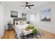 Bedroom with a comfortable bed, hardwood floors and natural light at 1901 S Lincoln St, Denver, CO 80210