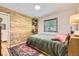 Bright bedroom with wooden accent wall, stylish rug, and natural light at 2844 Bellaire St, Denver, CO 80207