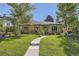 Charming single-story home with a well-manicured lawn and inviting walkway at 2844 Bellaire St, Denver, CO 80207