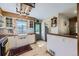 Cozy kitchen featuring white cabinetry, butcher block countertops, and stylish lighting fixtures at 2844 Bellaire St, Denver, CO 80207