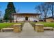Inviting facade of a public library featuring a grand entrance, manicured lawns, and accessible walkway at 2844 Bellaire St, Denver, CO 80207