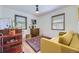 Cozy living room featuring bright light, a couch, rug, and a vintage dresser at 2844 Bellaire St, Denver, CO 80207