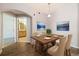 Inviting dining area with stylish table setting, hardwood floors, and tasteful decor, ideal for meals and gatherings at 3890 S Dayton St # 105, Aurora, CO 80014