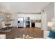 Bright kitchen and dining area with stainless steel appliances, hardwood floors, and modern white cabinets at 3890 S Dayton St # 105, Aurora, CO 80014