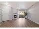 Bright living room with fireplace, sliding glass doors, and attractive and durable flooring at 3890 S Dayton St # 105, Aurora, CO 80014