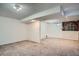 Spacious basement with a mix of carpet and neutral walls, offering versatile living space at 5274 Alkire St, Arvada, CO 80002