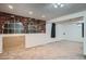 Spacious basement with brick-style windows, neutral carpet, and white walls at 5274 Alkire St, Arvada, CO 80002