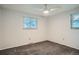 Bright bedroom with fan and windows, neutral colored walls and carpeting at 5274 Alkire St, Arvada, CO 80002