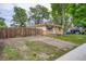 Charming brick home with a fenced yard and a gravel driveway at 5274 Alkire St, Arvada, CO 80002