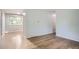 Open living room with wood floors and neutral walls, ready for personal touches at 5274 Alkire St, Arvada, CO 80002