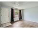 Bright living room featuring wood floors, natural light, and neutral paint at 5274 Alkire St, Arvada, CO 80002