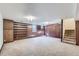 Finished basement with built-in shelving and stairs at 1518 Chambers Dr, Boulder, CO 80305