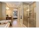 Bathroom with tiled shower and soaking tub near the bedroom at 15265 W Baker Ave, Lakewood, CO 80228