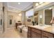 Bright bathroom features a soaking tub and separate shower at 15265 W Baker Ave, Lakewood, CO 80228